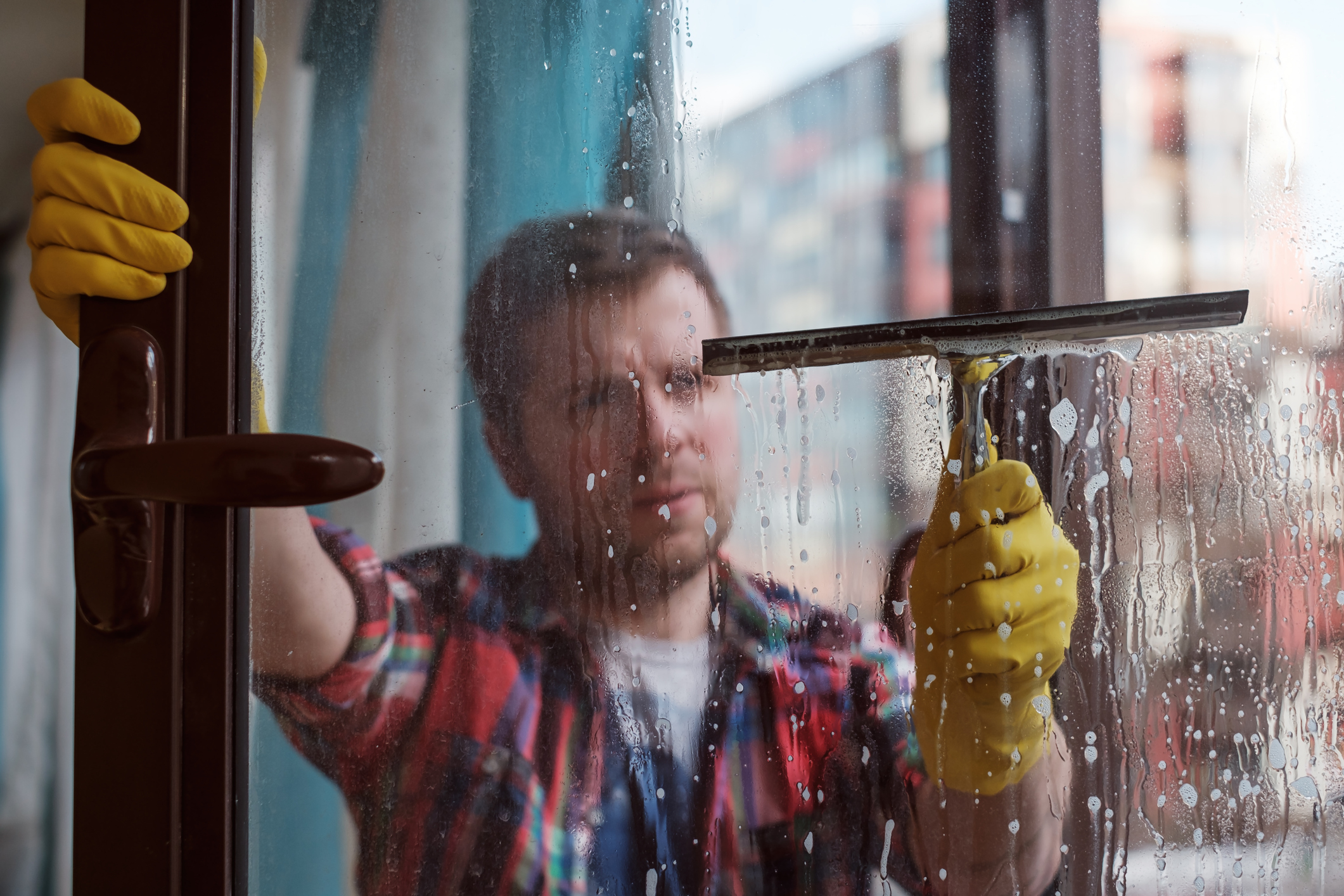 Man Cleans Window
